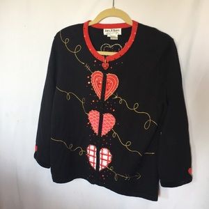 Zippered sweater with hearts.